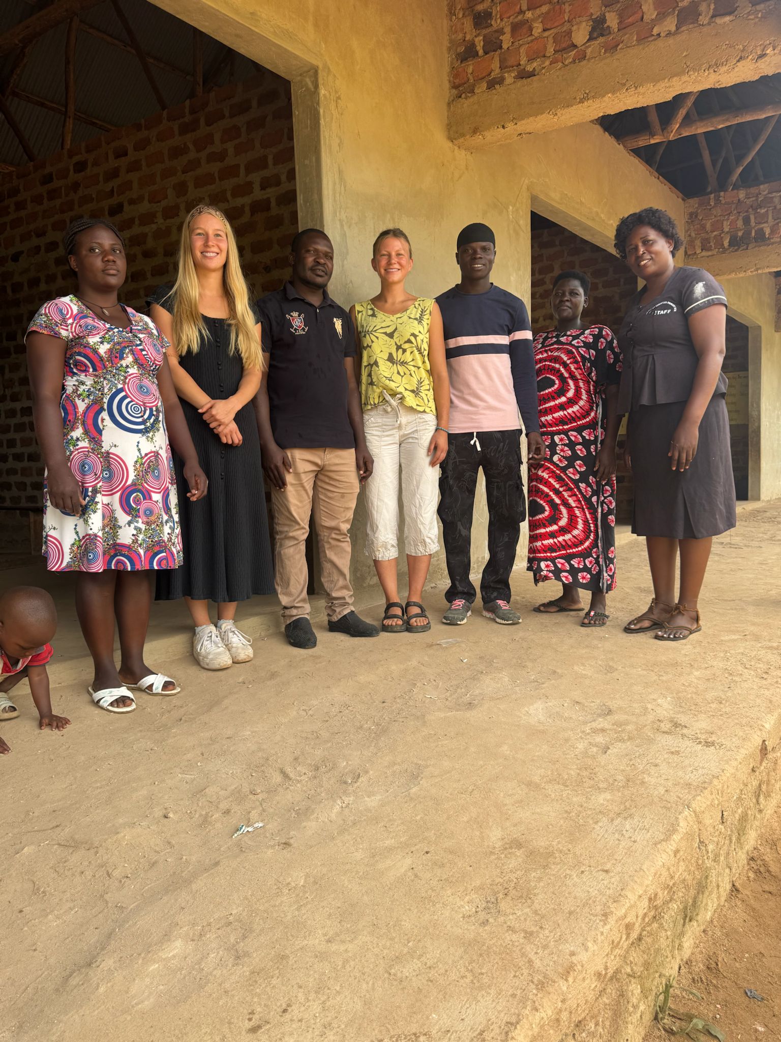 Fight Fever Mende team — local staff and international volunteers at Shekinah School, Mende Uganda
